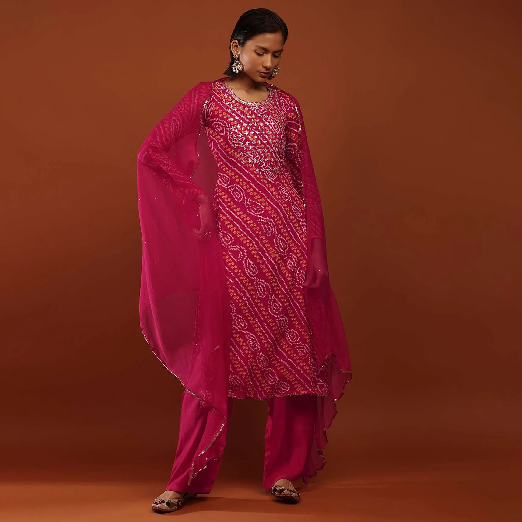 Magenta Pink Suit In Georgette With Bandhani Print And Gotta Embroidered Yoke
