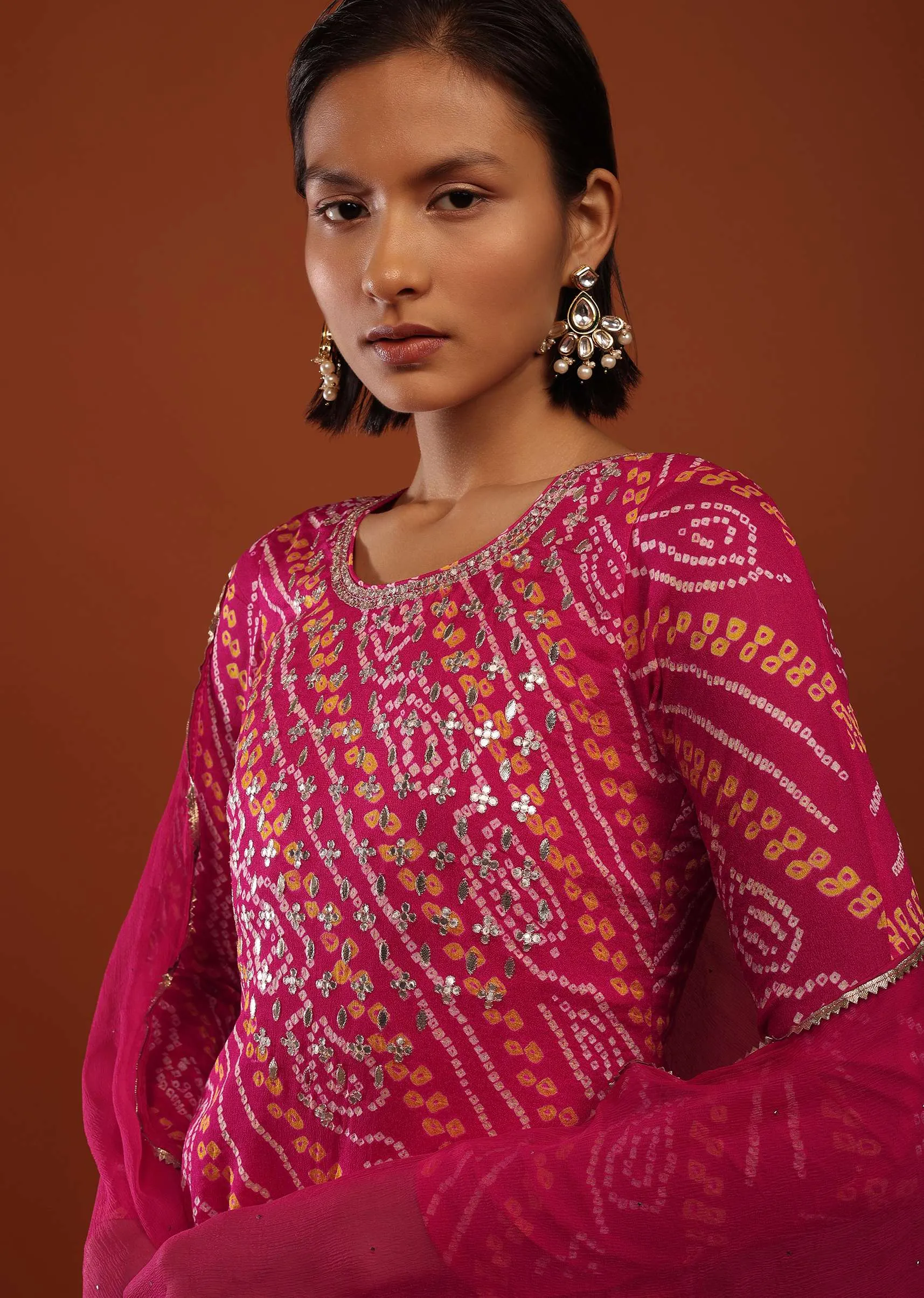 Magenta Pink Suit In Georgette With Bandhani Print And Gotta Embroidered Yoke